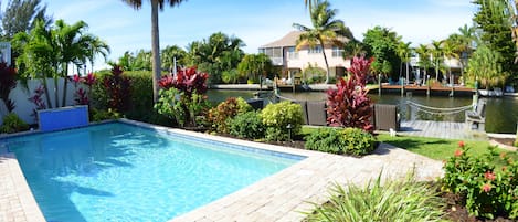 A heated pool and 30' private boat dock will accommodate the largest of yachts.