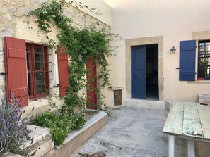 The "breakfast patio" - kitchen to the left, living room through the blue door
