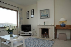 Sitting room with open fire.