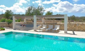 Deck level pool and shaded lounge area