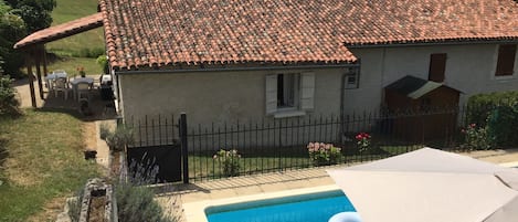 aerial view - pool partly shaded by umbrella