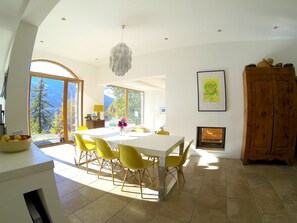 Breakfast/dining table with lounge beyond. Photo from the early Autumn