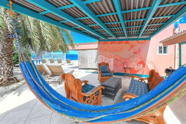 This private patio with a hammock only feet away from the beach is perfect for morning coffee or sunset drinks!