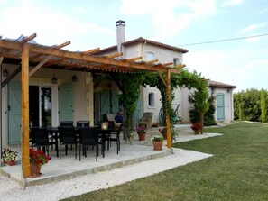 Two shaded patio areas, one for sitting and one for eating.