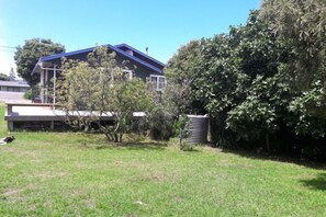 Large back lawn with fruit trees which provide good shade in the hot weather.