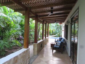 Year-round outside pergola area with ceiling fans.