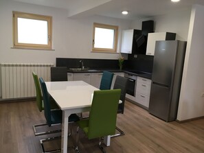 Spacious kitchen with dining table