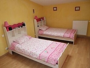 Sunny twin bedroom with blackout blinds