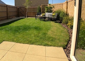 Sunny, enclosed garden with rear access to drive and garage