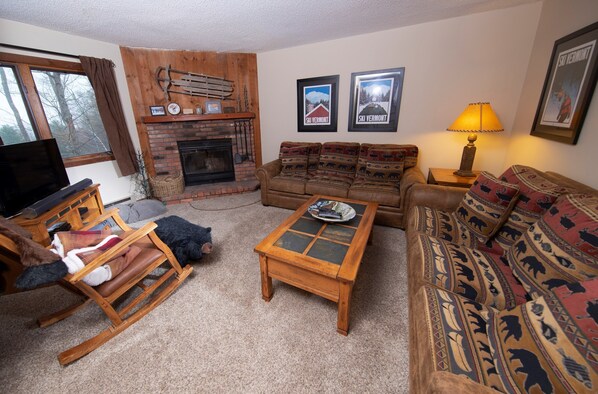 Sit back and relax in our cozy condo after a great day! (Please note that the decor varies).
