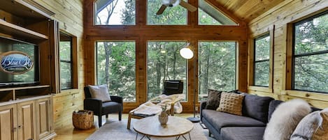 Living room with forest backdrop