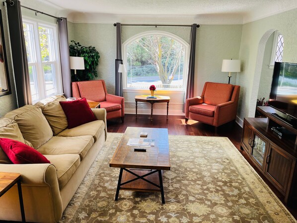 Big, beautiful living room. Sofa has a queen-size pull-out bed with a memory foam mattress.