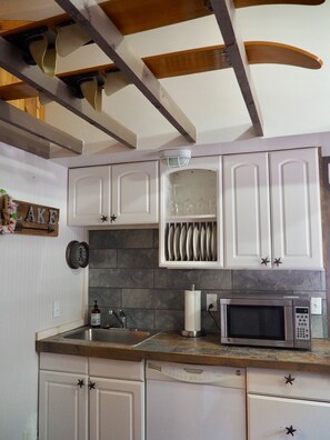 Kitchen includes Fridge, microwave, dishwasher, stove.  Washer and dryer.