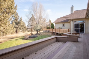 Large balcony and yard for entertaining.