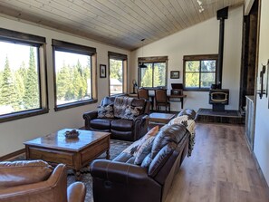 Main living room with wood burning stove.