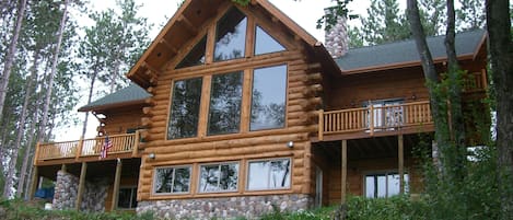 Authentic, spacious log cabin nestled on the Pine River. Sleeps up to 28.