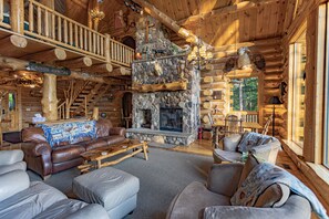 Lots of comfy seating surrounds the stone fireplace. Very popular with Guests.