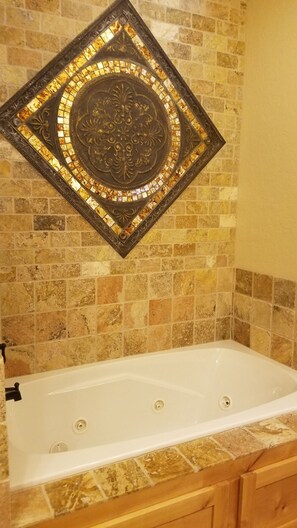 Relax in the jetted tub in the master bath