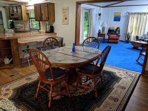 spacious open dining room, dining table and breakfast nook seating