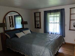 Master bedroom with queen size bed, plenty of closet space and small safe.