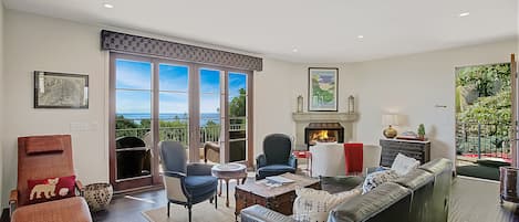 Living room w fireplace, open floorplan and high end furnishings