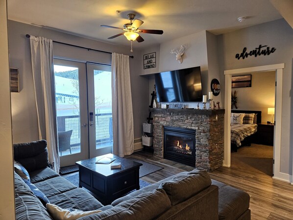 Living Room with Sleeper Sectional, cozy Gas Fireplace & 58 inch Roku Smart TV