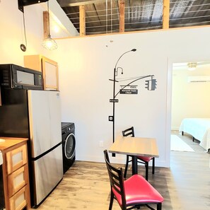 Kitchen with apartment size appliances and washer. Fully Furnished kitchen!