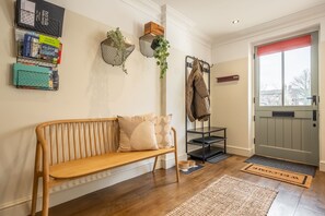 Castle House : Main entrance with a bench seat to take boots off and storage for shoes and coats