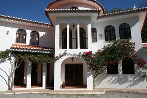 The porch with shady balcony above.