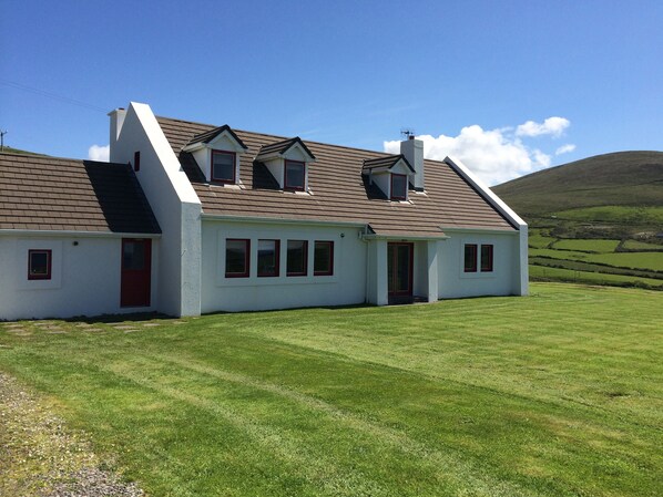 The house sits in half an acre of grounds, all laid out in grass