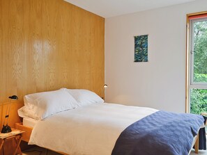 5ft double bed in wood-panelled bedroom | West Bothy at Cluain Ghrianach, Laga, near Acharacle