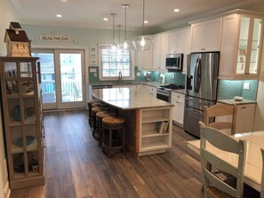 View of kitchen from dining room.  The kitchen is fully stocked and ready for use