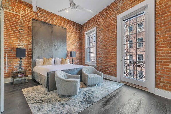 Spacious master bedroom with king-size bed, ensuite bathroom, and designer built-in closets. Equipped with lamps, hangers, luggage racks, alarm clock, white noise machine, and a 55'' Samsung Smart 4K TV with streaming and DIRECTV Entertainment.