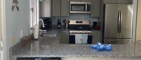 Newly renovated kitchen. Granite countertops. June 2022.