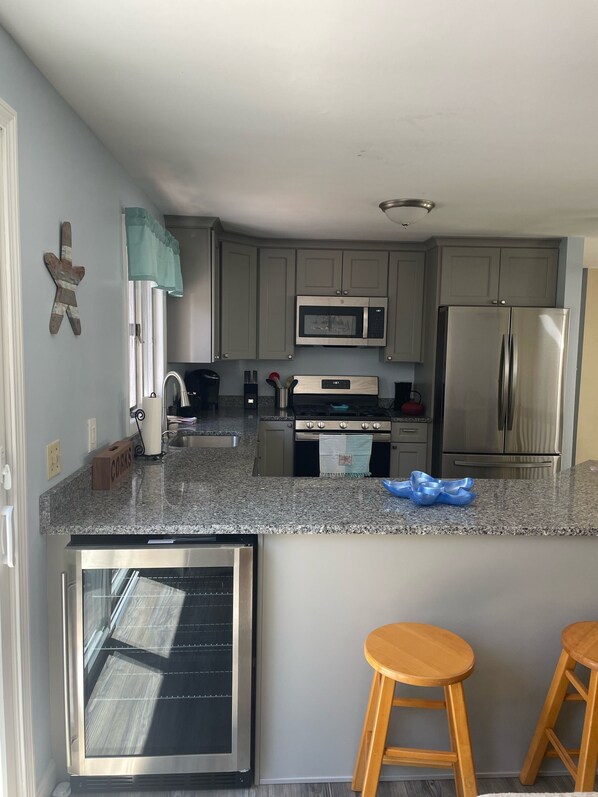 Newly renovated kitchen. Granite countertops. June 2022.