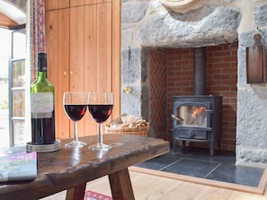 Cosy living room with wood burner | The Byre - Lyserry Barns, Bosherston, near Pembroke