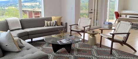 Living room with floor to ceiling windows