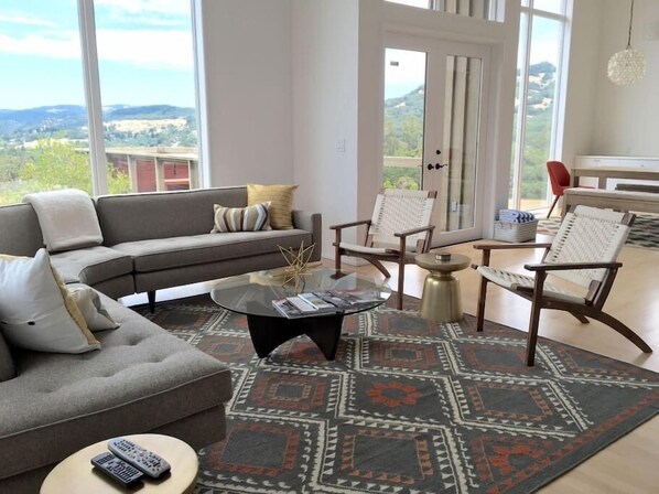 Living room with floor to ceiling windows