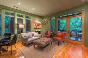 Open living room area with gas log fireplace and TV (cable and streaming available).