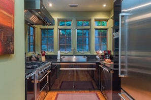 High-end kitchen featuring Viking appliances, dishwasher, and standard drip-style coffeemaker.