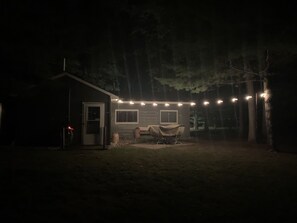 Back of cabin with lighting for night