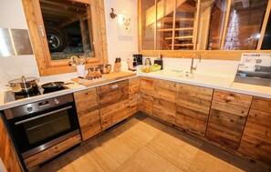 The fully-equipped kitchen features all the amenities you'd need to make a delicious meal.