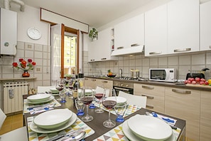 The seperated kitchen with dining table