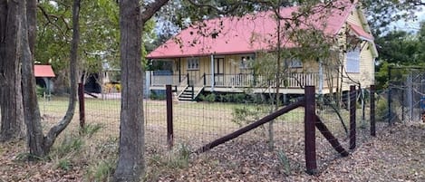 The 'Old Schoolhouse' with tennis court on the right side.
