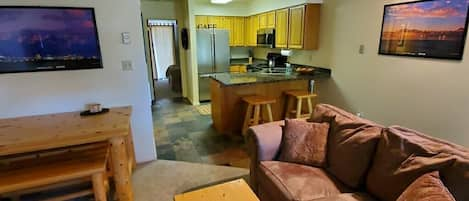 This is the main living area upstairs with fireplace and kitchen 