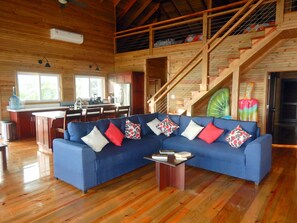The great room – loft stairway, open plan living room, kitchen, …