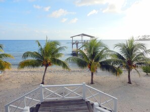 View from the porch showing the stairs, beach and the private 2-level dock