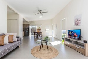 Open plan living dining with smart tv family friendly