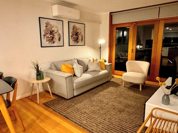 Open plan lounge dining which opens out onto deck
