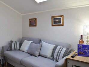 Comfortable seating within living area | Cuillin View Apartment - Cuillin View Properties, Near Arisaig